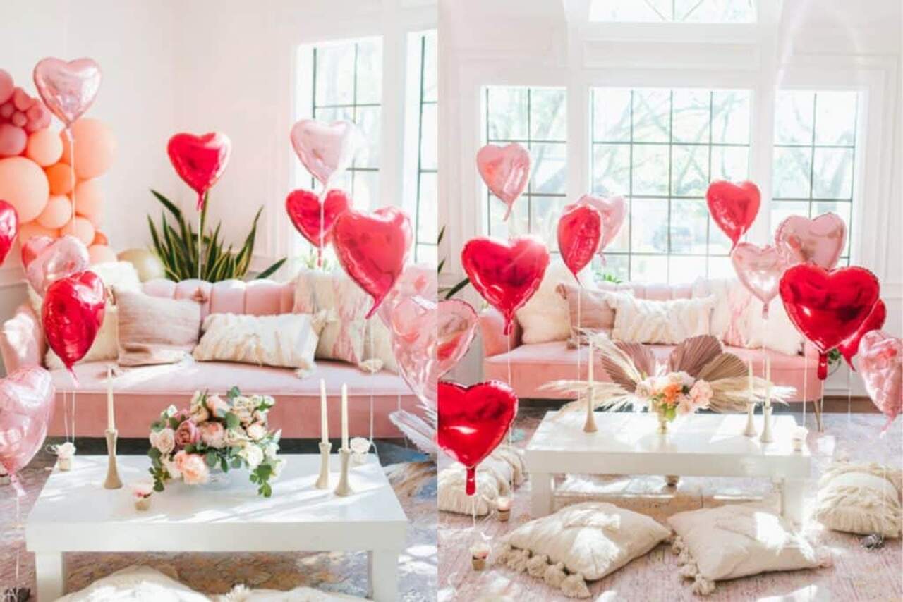 Sala decorada com balões rosas e vermelhos metálicos 